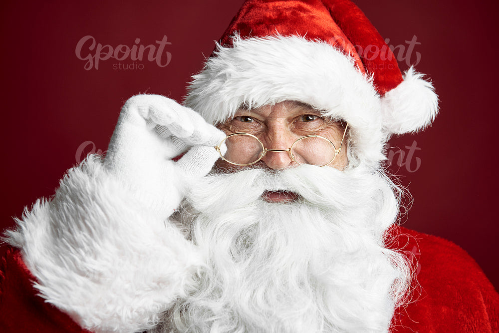 Close up of Santa Claus on the red background 
