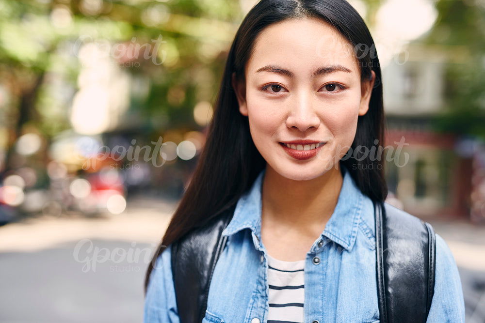 Portrait of Vietnamese young woman with big smile on her face