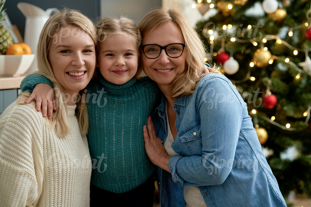Portrait of three generations of women during Christmas time