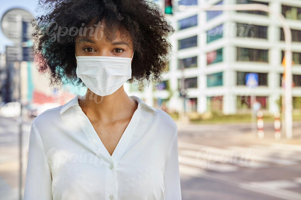 Portrait of woman  in protective face mask on the street