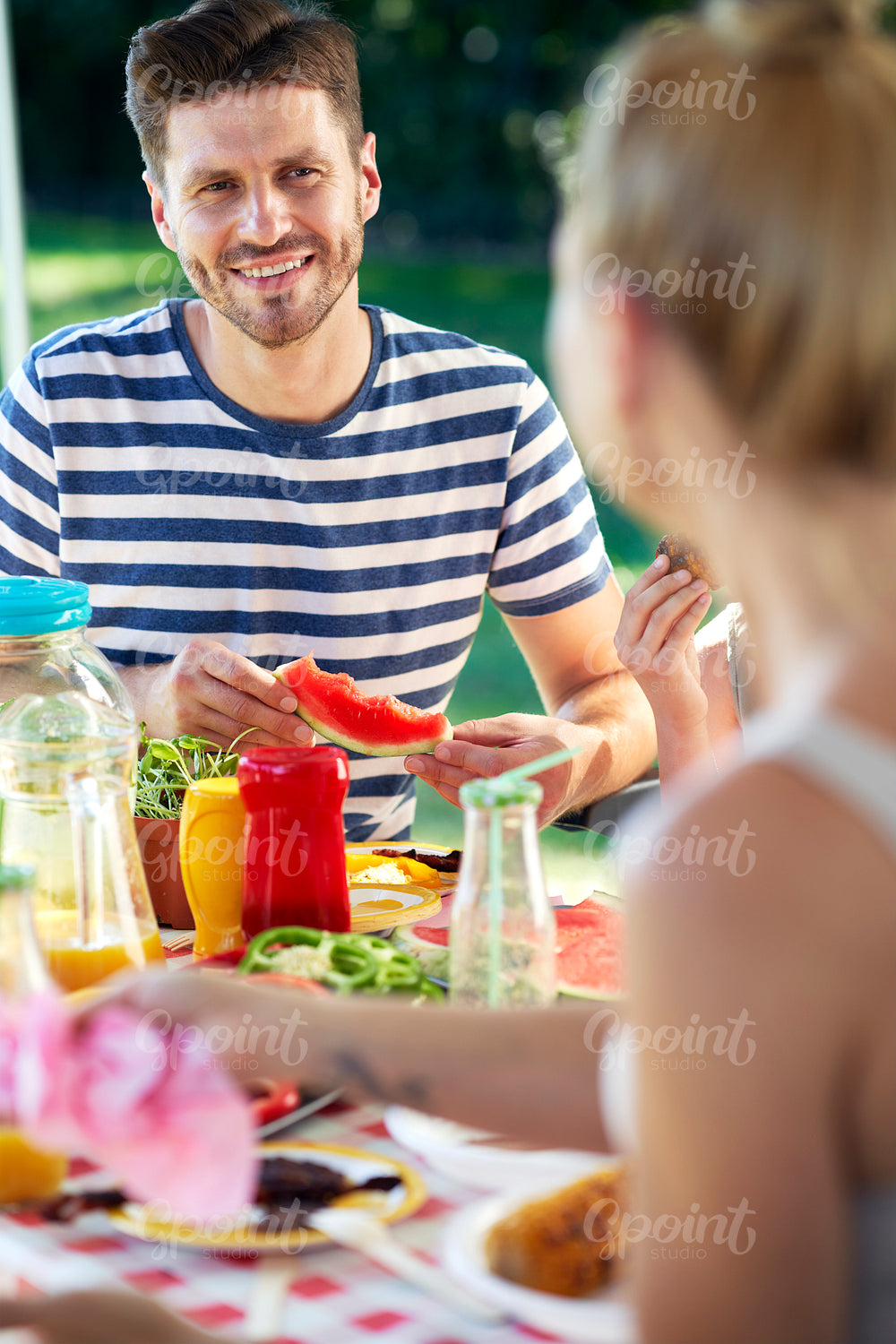 Vertical image of couple spending time on barbecue