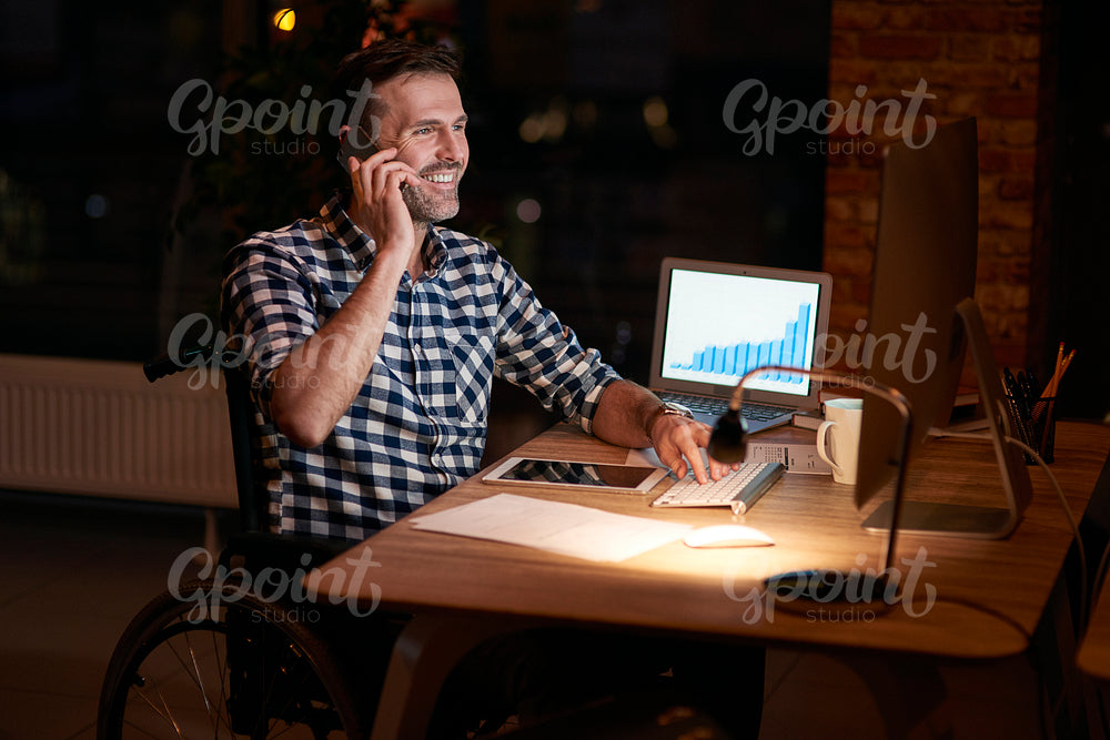 Disabled businessman working in office