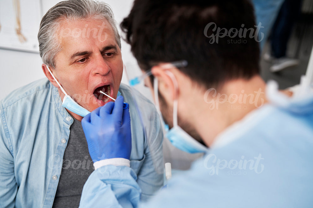 Close up of doctor taking sample for testing