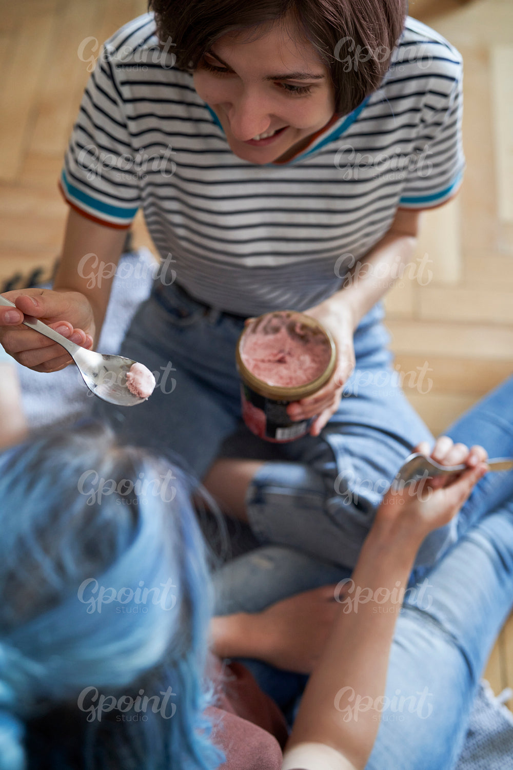 Top view of women sitting and eating ice cream