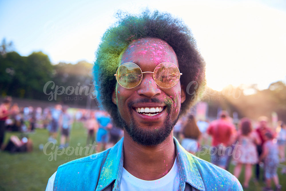 Smiling African man in holi colors