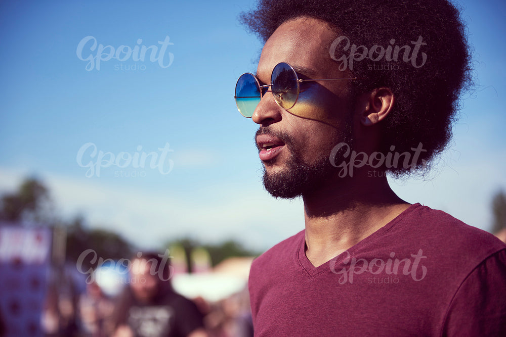 Shot of young African man with sunglasses