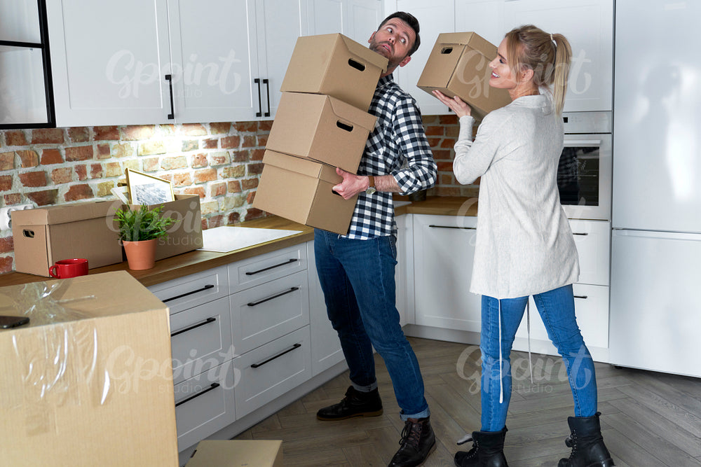 Couple take the cardboard boxes when they move out