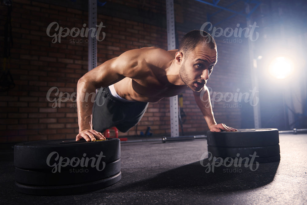 Muscular man working on body strength