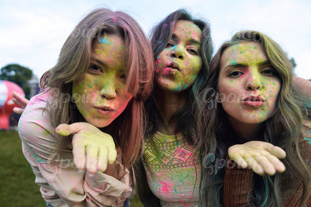 Group of friends enjoying the colour powder festival 