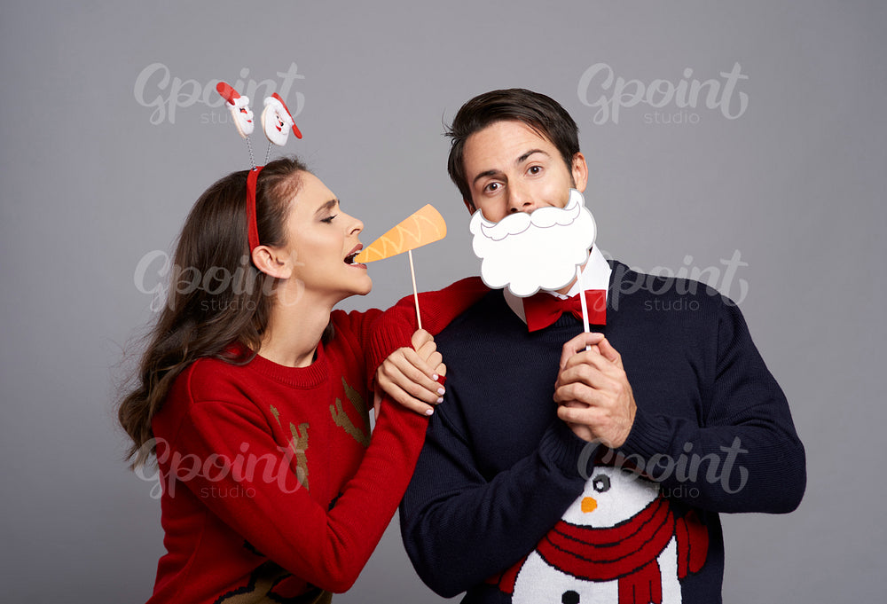 Couple with funny Christmas masks