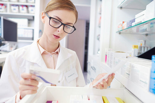 Close up of busy female pharmacist