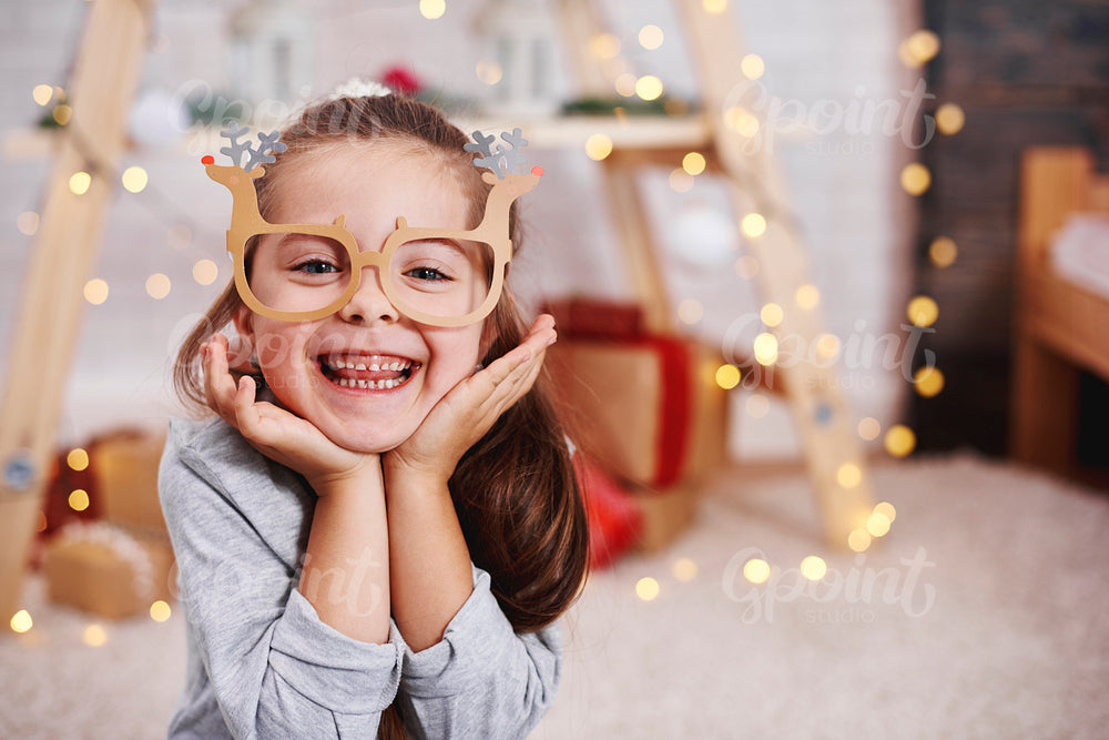 Portrait of adorable girl with funny glasses
