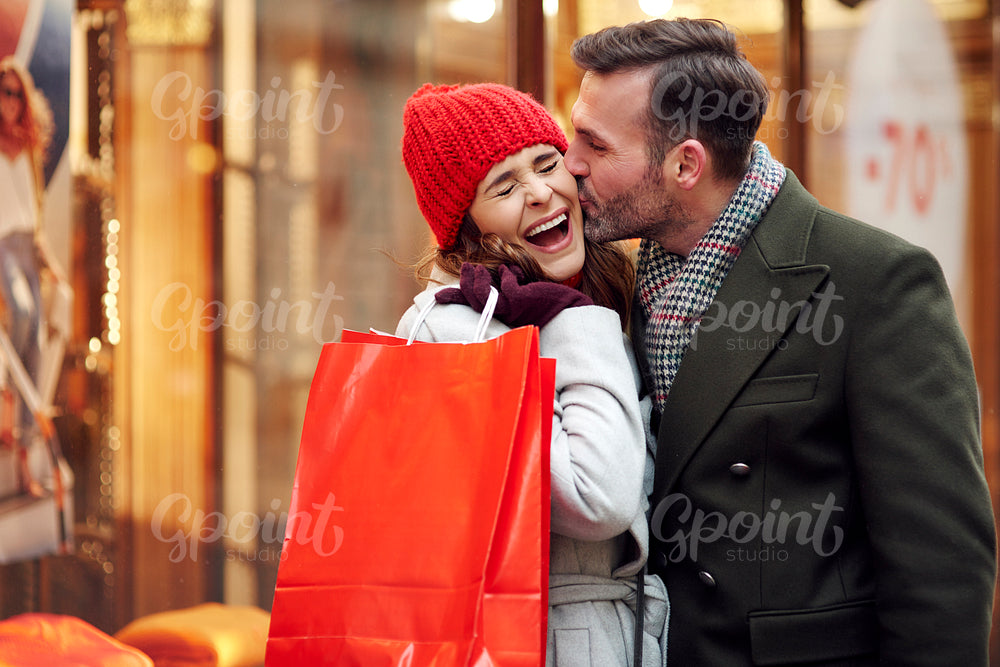 Romantic scene during Christmas shopping