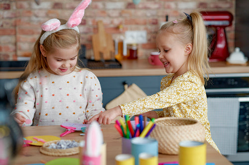 Two girls making decorations for Easter