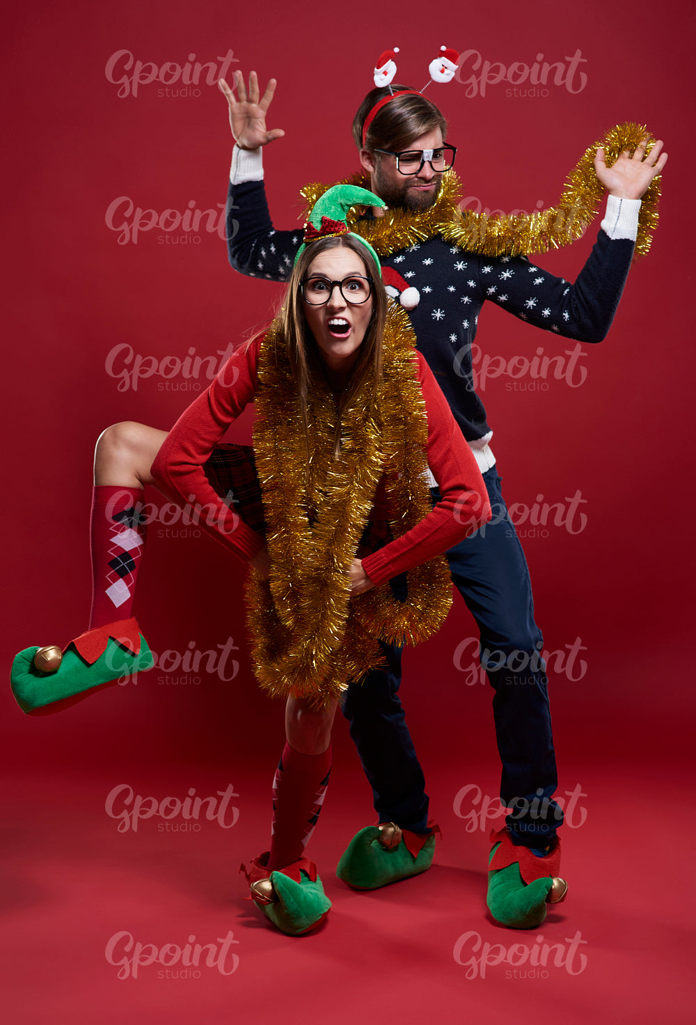 Crazy couple wearing golden Christmas chain