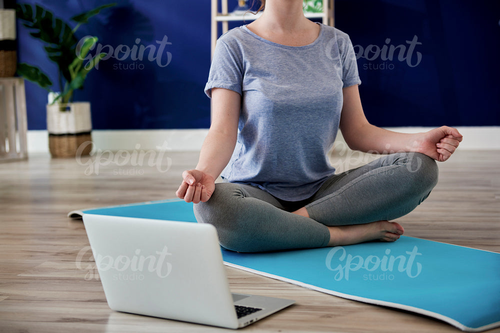 Unrecognizable woman doing some meditation exercises