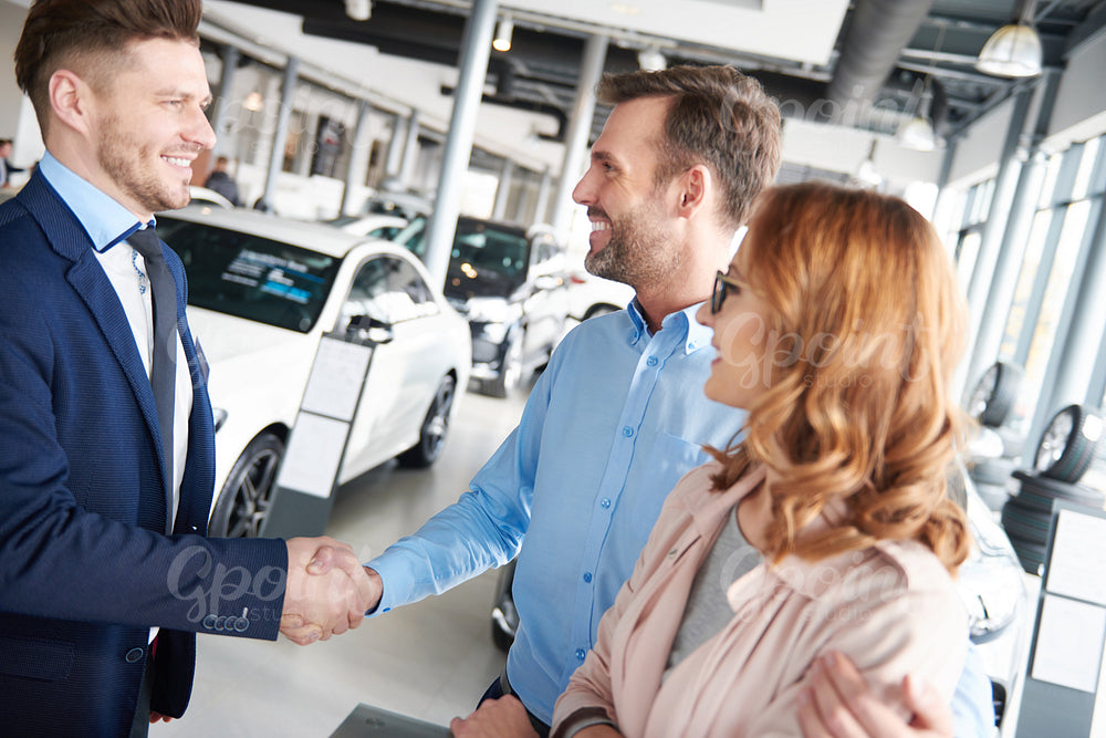 Handshake between male customer and salesman