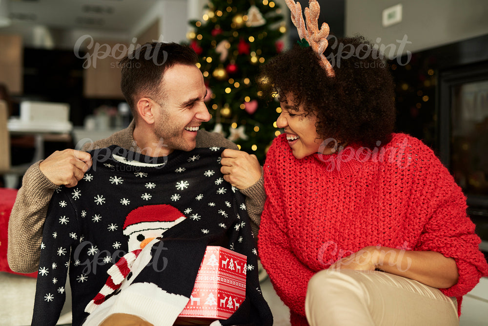 Playful couple in Christmas time