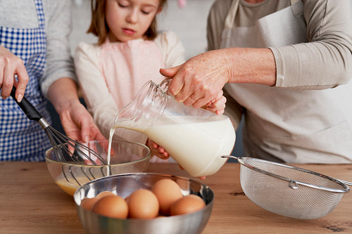 Close up of girl helping in the kitchen while baking