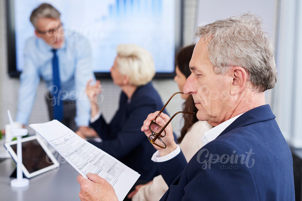 Business person reading important documents