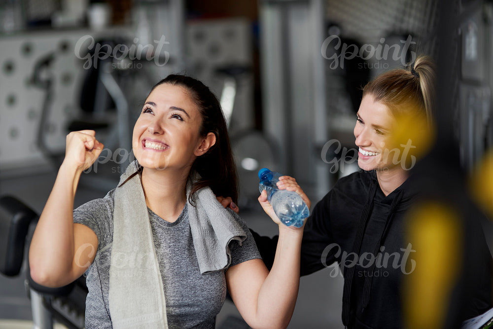 Happy couple after workout at gym