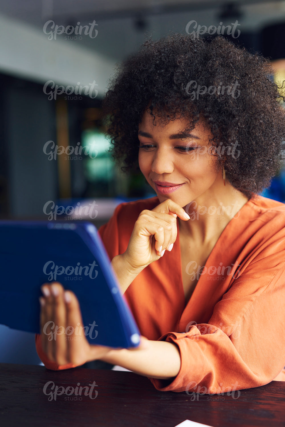 Young African woman working with technology