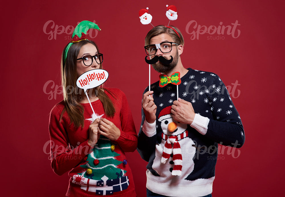 Boyfriend and girlfriend with Christmas masks