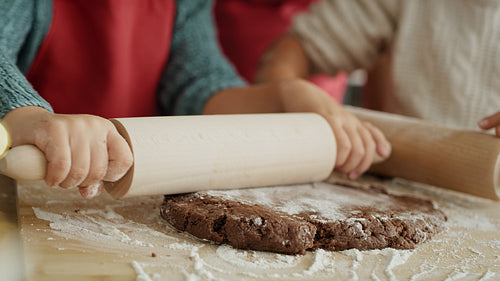 Handheld video of children preparing pastry for Christmas gingerbreads