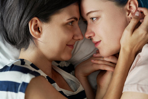 Top view of lesbian couple looking deep in the eyes