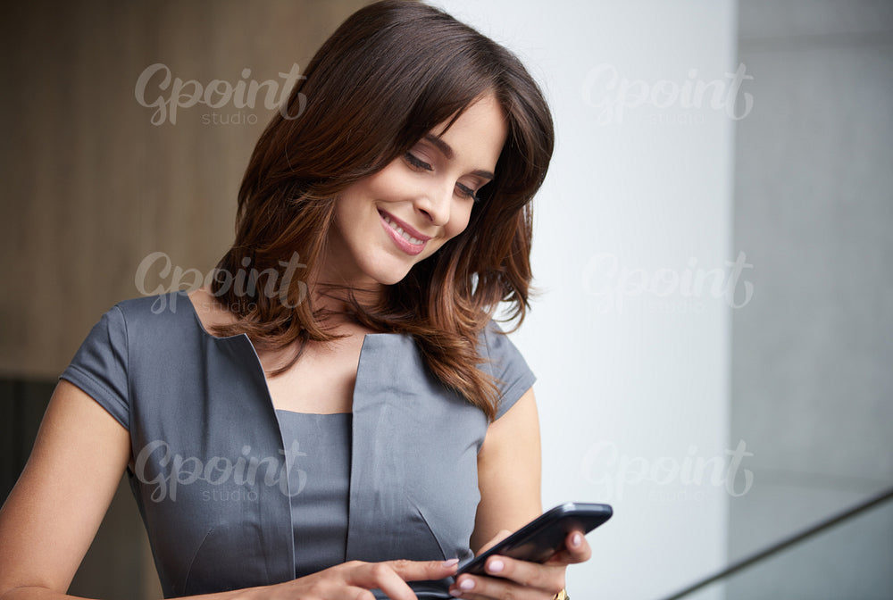 Young businesswoman with a phone
