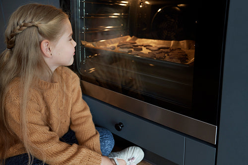 Little girl cannot wait for homemade cookies