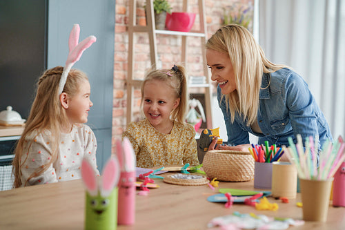Mum and two daughters have fun making Easter decorations