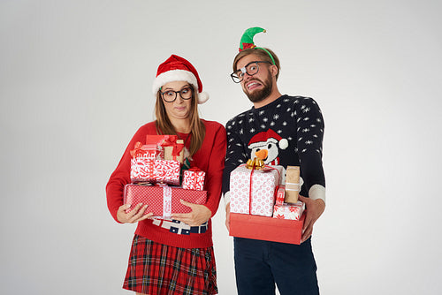 Couple with big stack of Christmas presents