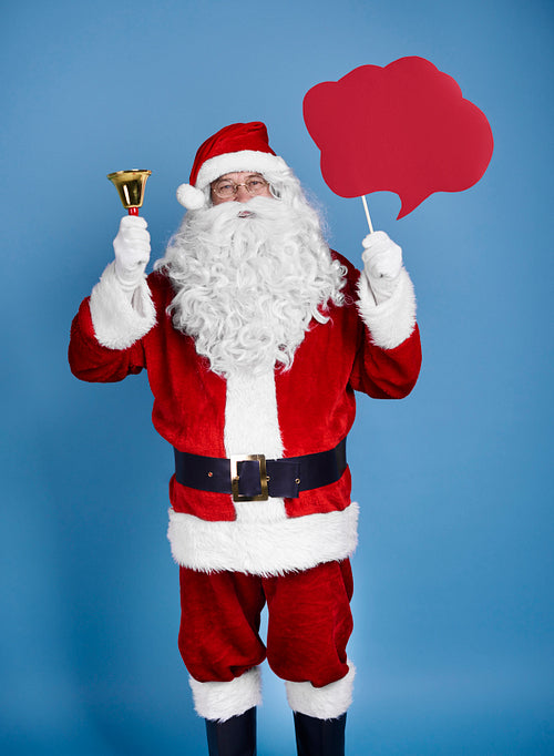 Santa claus holding speech bubble and bell