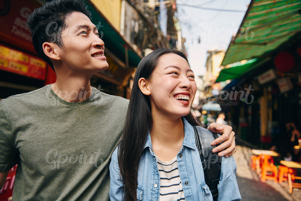 Happy couple exploring the Hanoi city