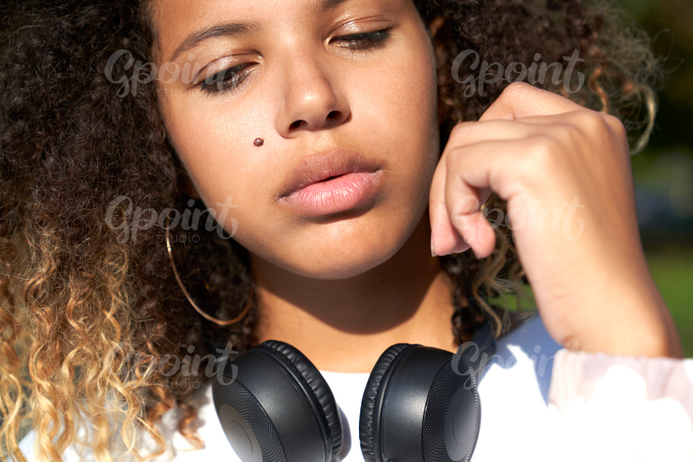 Close up of African woman with headphones
