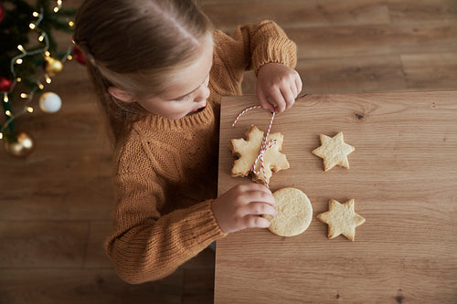 Top view of girl packing cookies for Santa Claus