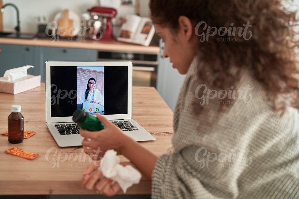 Sick woman during telemedicine at home