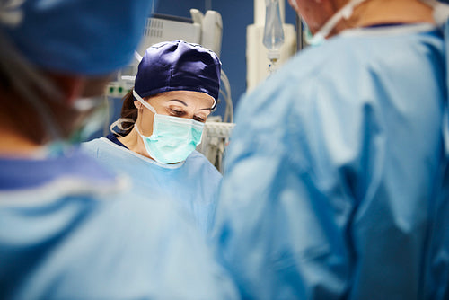 Mature female surgeon during an operation