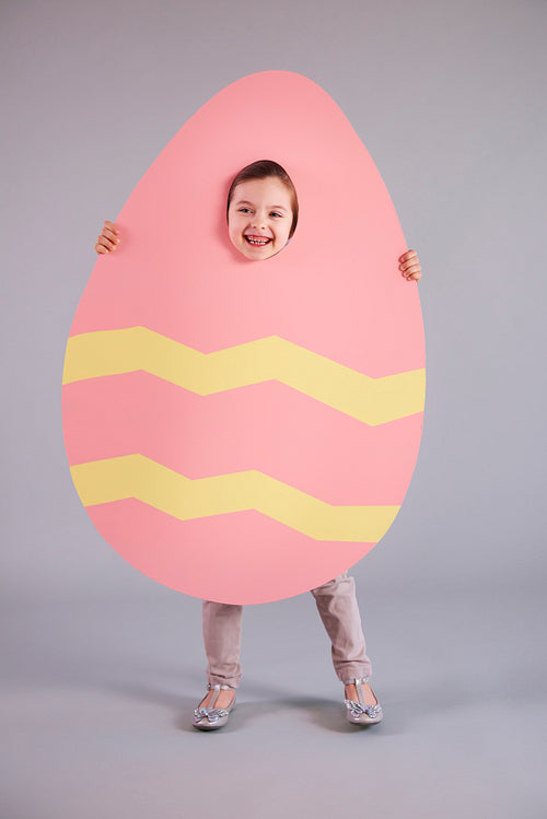 Shot of playful child with easter egg