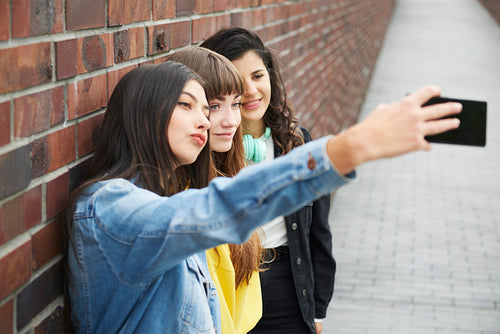 Hipster friends making a selfie by mobile phone