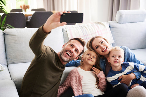 Selfie of happy family with two children