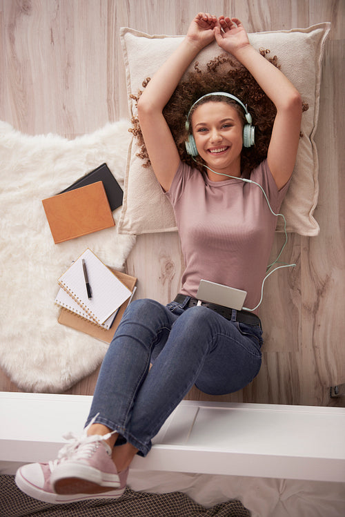 Portrait of  teenage girl listening to music
