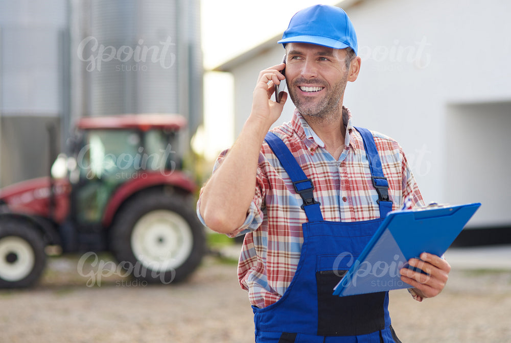 Farmer controlling his agricultural business
