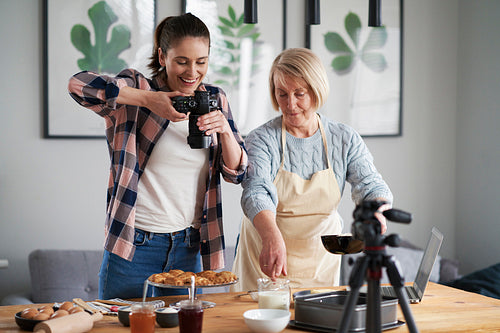 Mother and daughter making food photography