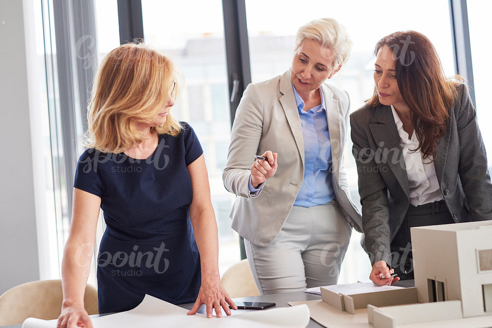 Female office workers having consultations about strategy
