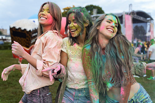 Group of multiracial friends have fun at Holi Festival