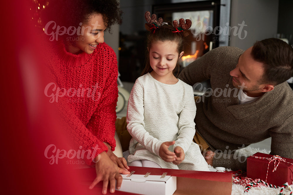 Family packing gifts for Christmas