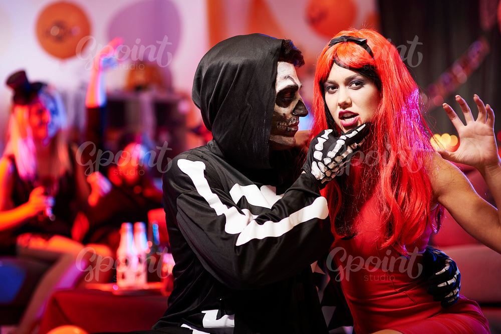 Sensual couple at halloween party