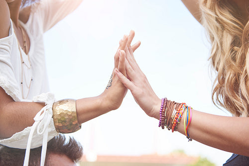 Two girls with bracelets on hands